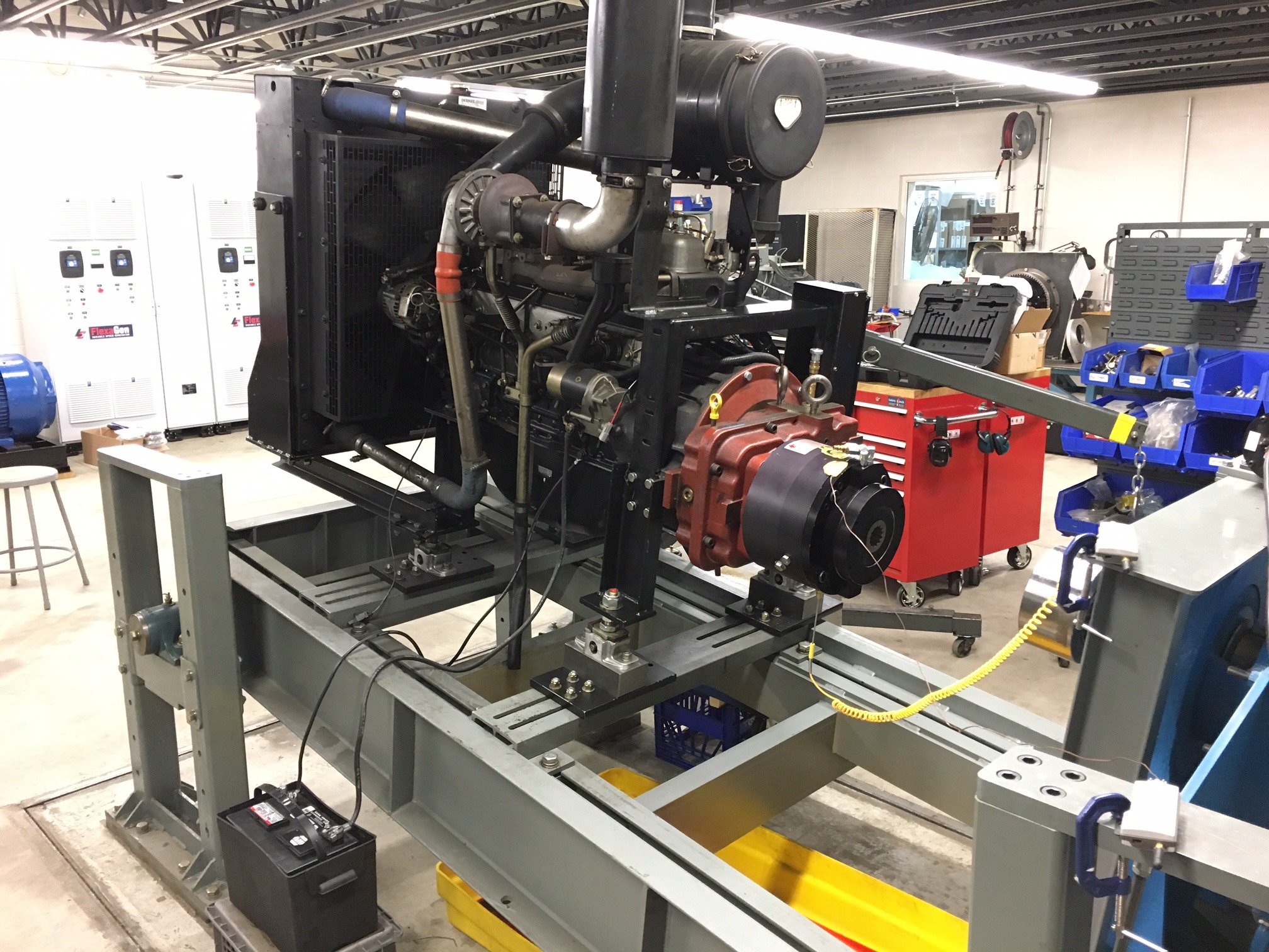 Logan Clutch Corp. Tech Center showing a Logan PTO mounted to a Durst 2-pad pump drive, powered by a Deere 4045 Diesel Engine